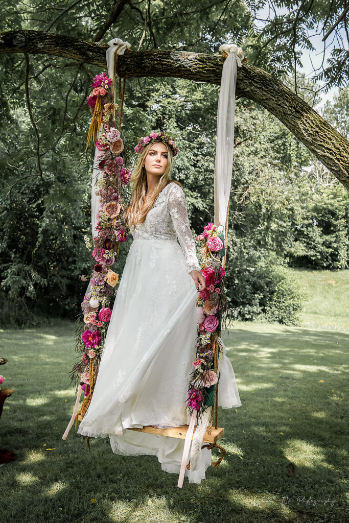 Bohemian Bride with Floral Installment on a swing at Cedar Bay Farm Lebanon, Ohio