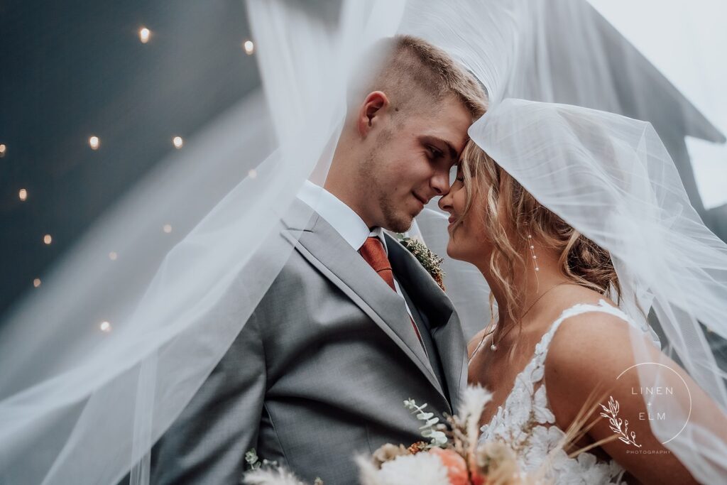 Beautiful Barn Wedding at Cedar Bay Farm | Linen & Elm Photography Couple under bridal veil