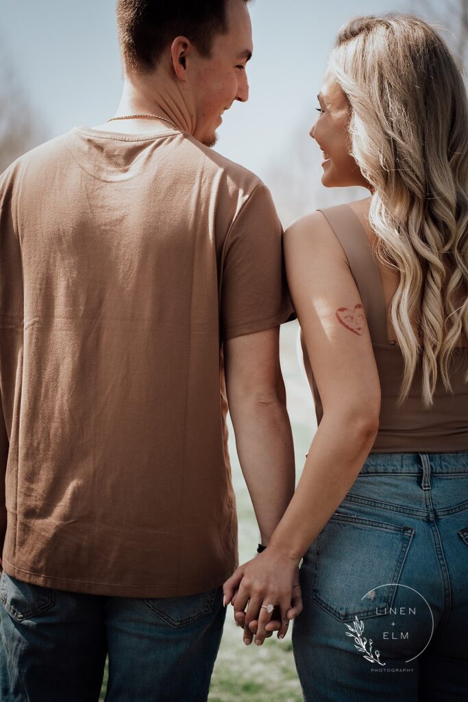 Couple Backs To Camera With Ring In Frame Engagement Photography Cox Arboretum Dayton Ohio 4 |