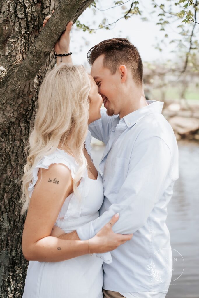 Couple kissing under tree Cincinnati Dayton Engagement Photography |