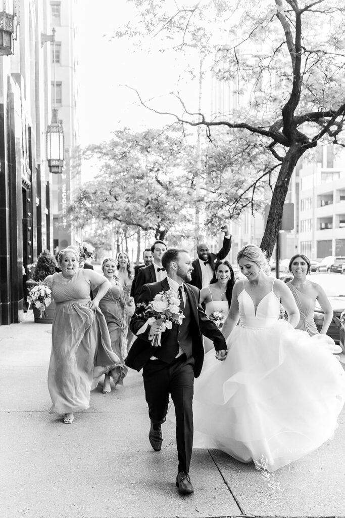 Bridal Party Running Down Street Cincinnati Wedding Photography Cincinnati Dayton Wedding Photographer Linen &Amp; Elm Photography Bridal Portrait Classic Bright Timeless Wedding Photographer Cincinnati Ohio Chicago_Illinois New_York New Destination Travel Fine Art High End_Luxury Wedding Engagement Elopement Photo Black White Elegant Traveling Travel