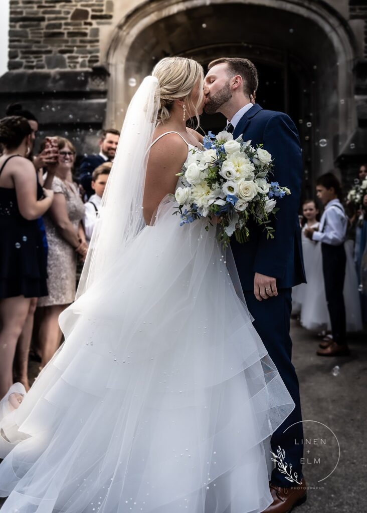 Kiss Outside Of Church Dayton Wedding Photographer