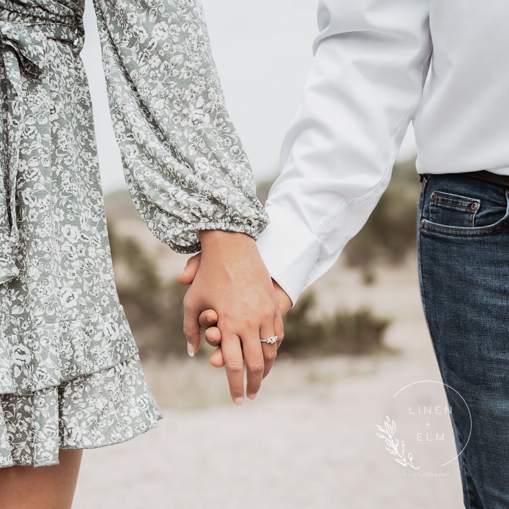 Engaged couple close up of rings couple holding hands in Ohio park, Bright Rustic Engagement Session Dayton Ohio