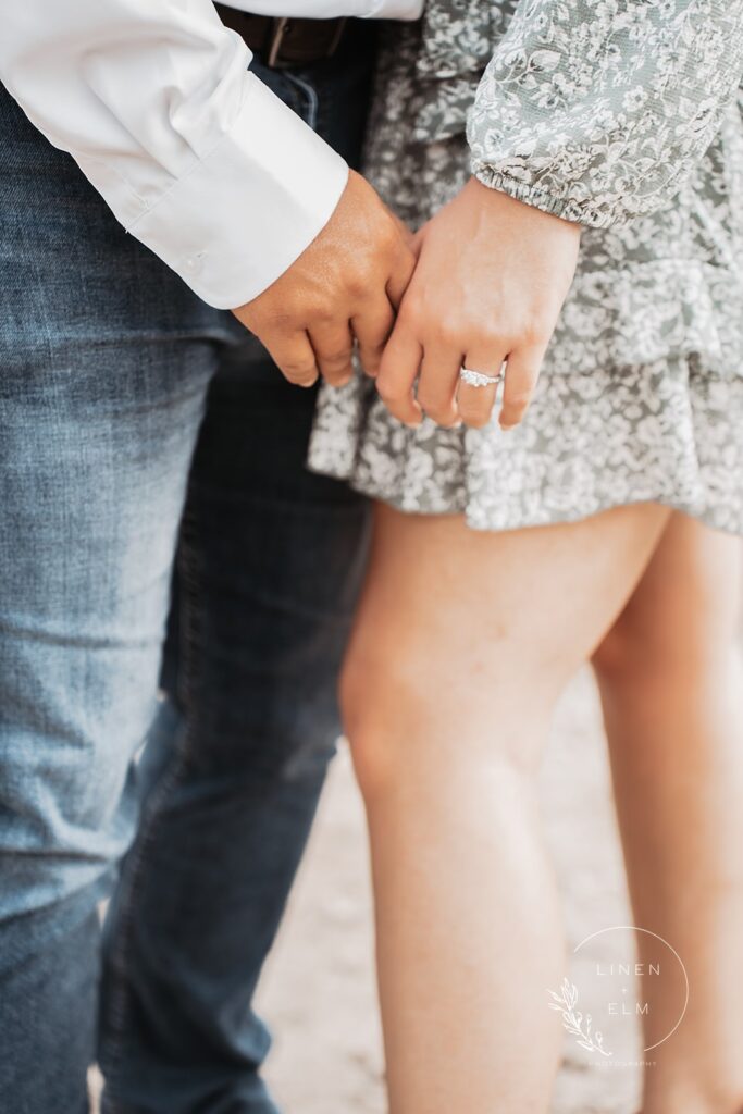 Image of hands of couple with ring featured. Bright Rustic Engagement Session Dayton Ohio