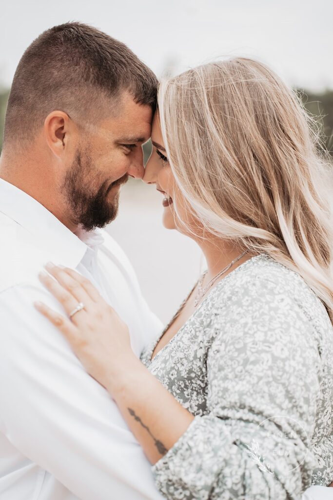 Couple looking into each others eyes during engagement session in an Ohio park, Bright Rustic Engagement Session Dayton Ohio