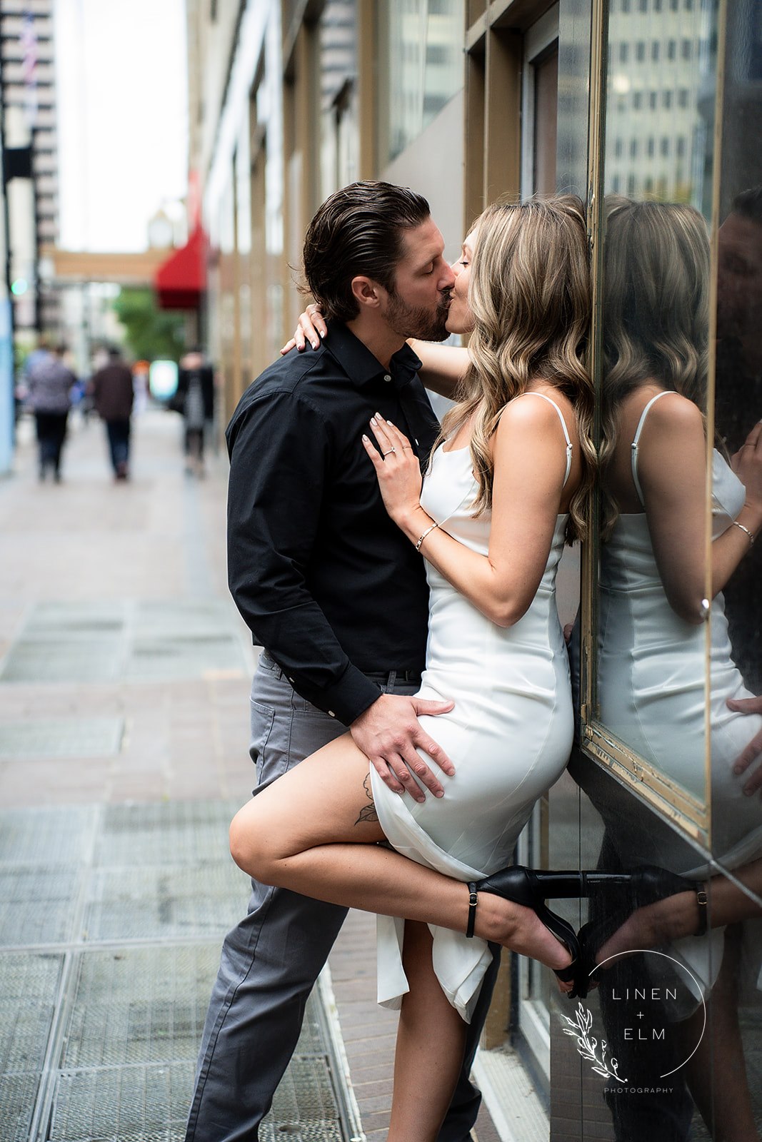 Couple Kissing In Front Of Hilton Netherland Plaza Hotel Engagement Photography