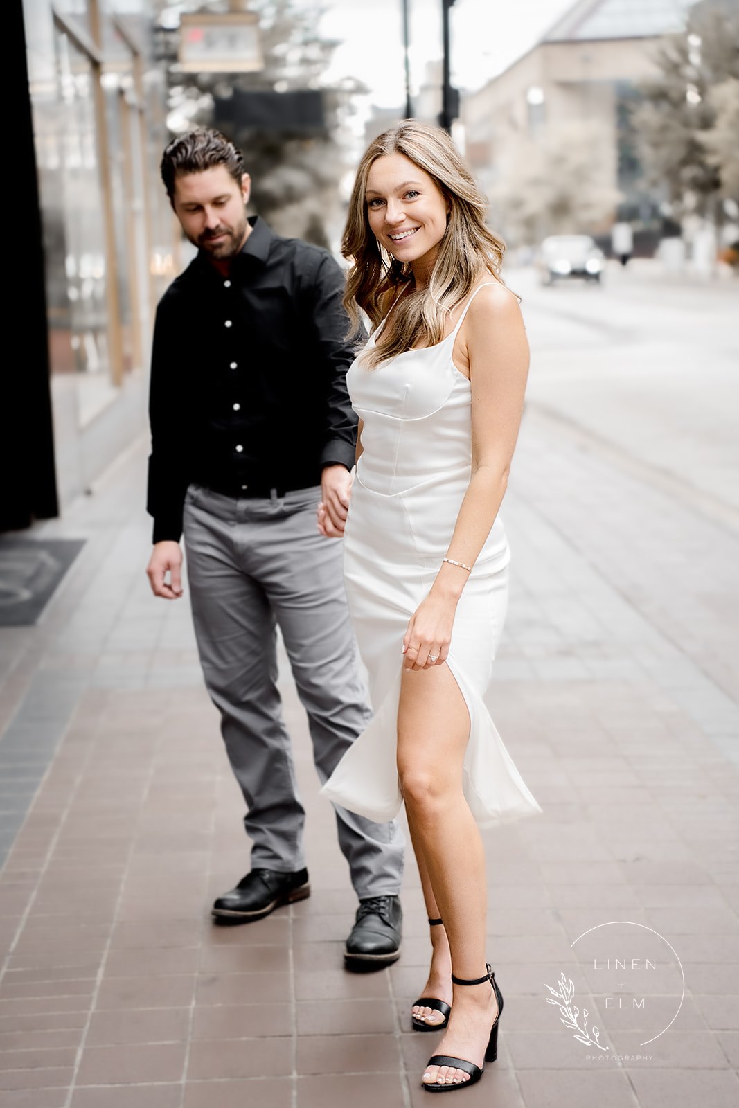 Couple in front of Hilton Netherland Plaza Hotel in Cincinnati engagement photos