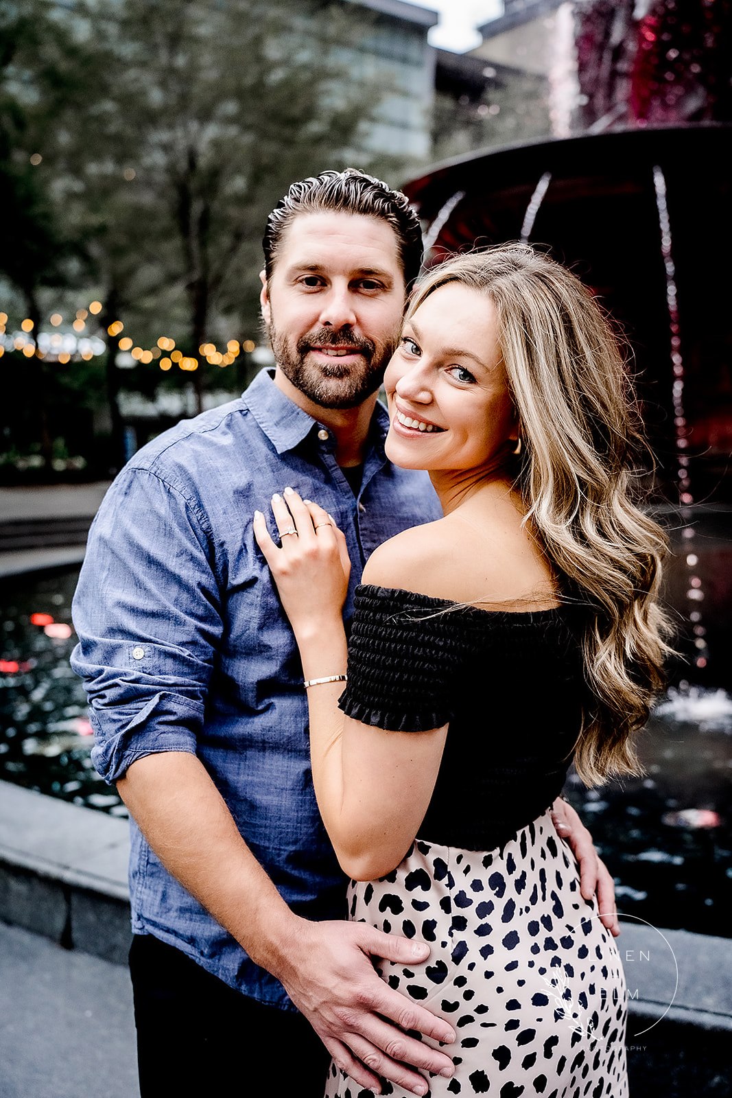 Engaged couple at Fountain Square Cincinnati Engagement Photographer