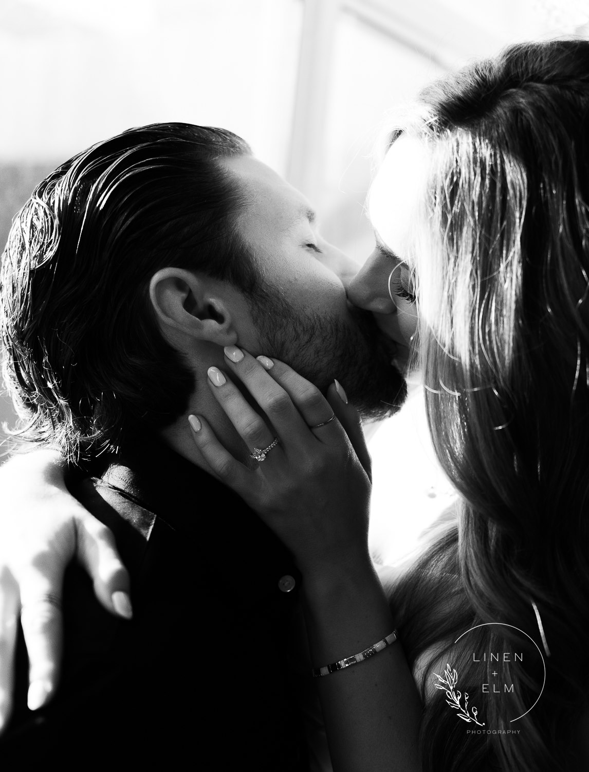 Couple kissing at Hilton Netherland Hotel Cincinnati Engagement Photographer