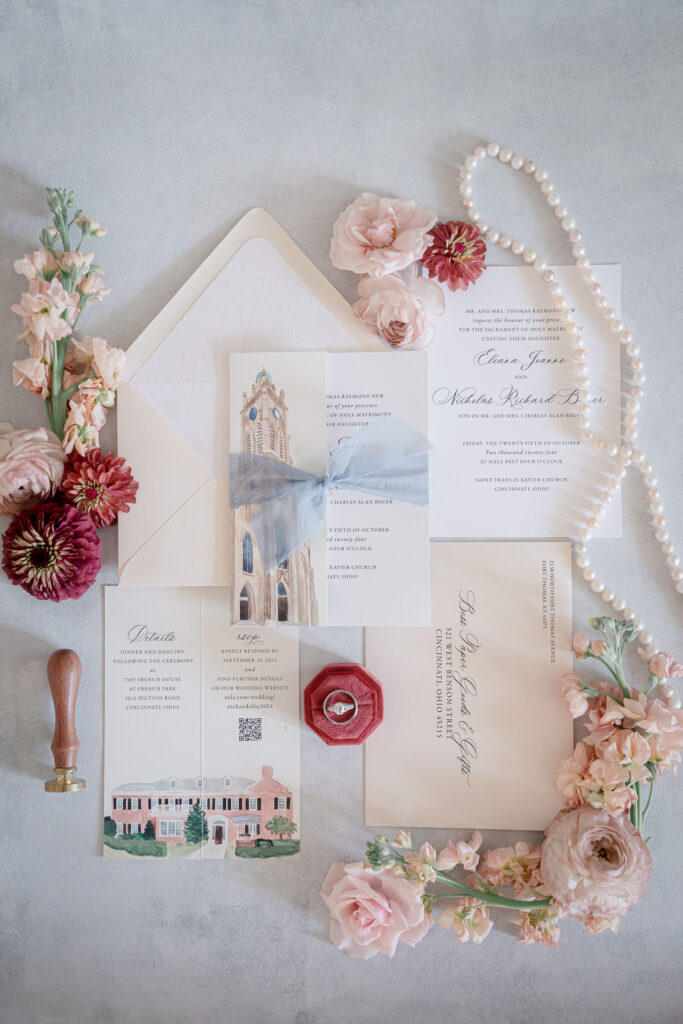 A Wedding Invitation With Flowers And A Stamp